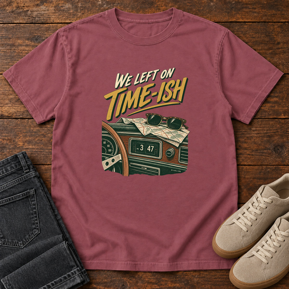 Brick We Left on Time-Ish T-Shirt with a retro dashboard, folded map and sunglasses; front flat lay on wood.