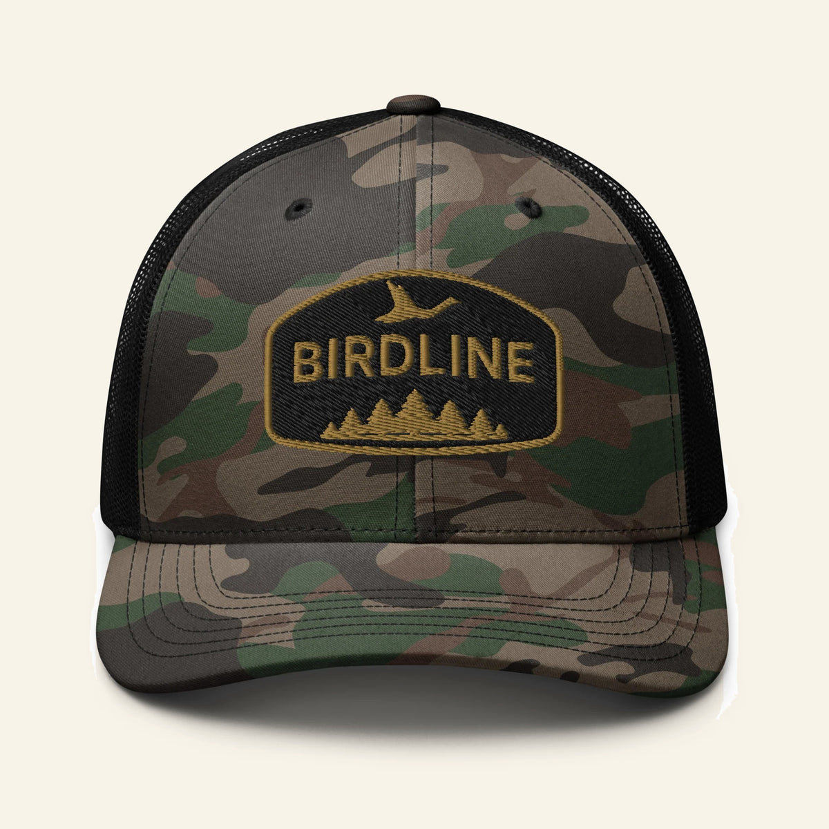 Birdline Pinewood Flight Camo Trucker Hat in Camo/Black, front view premium-quality garment detail