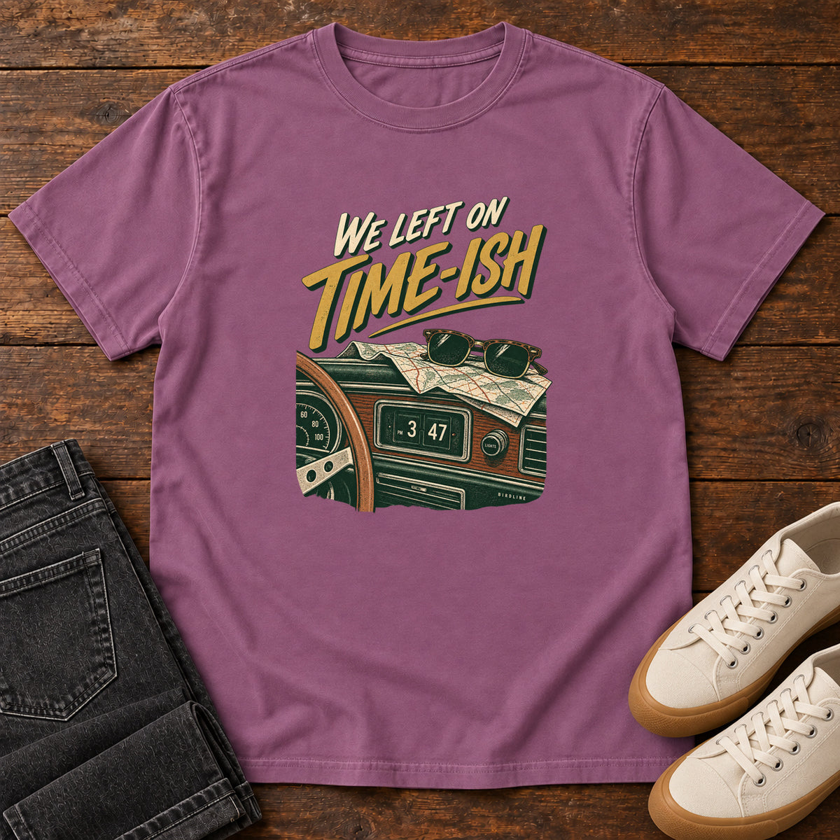 Berry We Left on Time-Ish T-Shirt with a retro dashboard, folded map and sunglasses; front flat lay on wood.