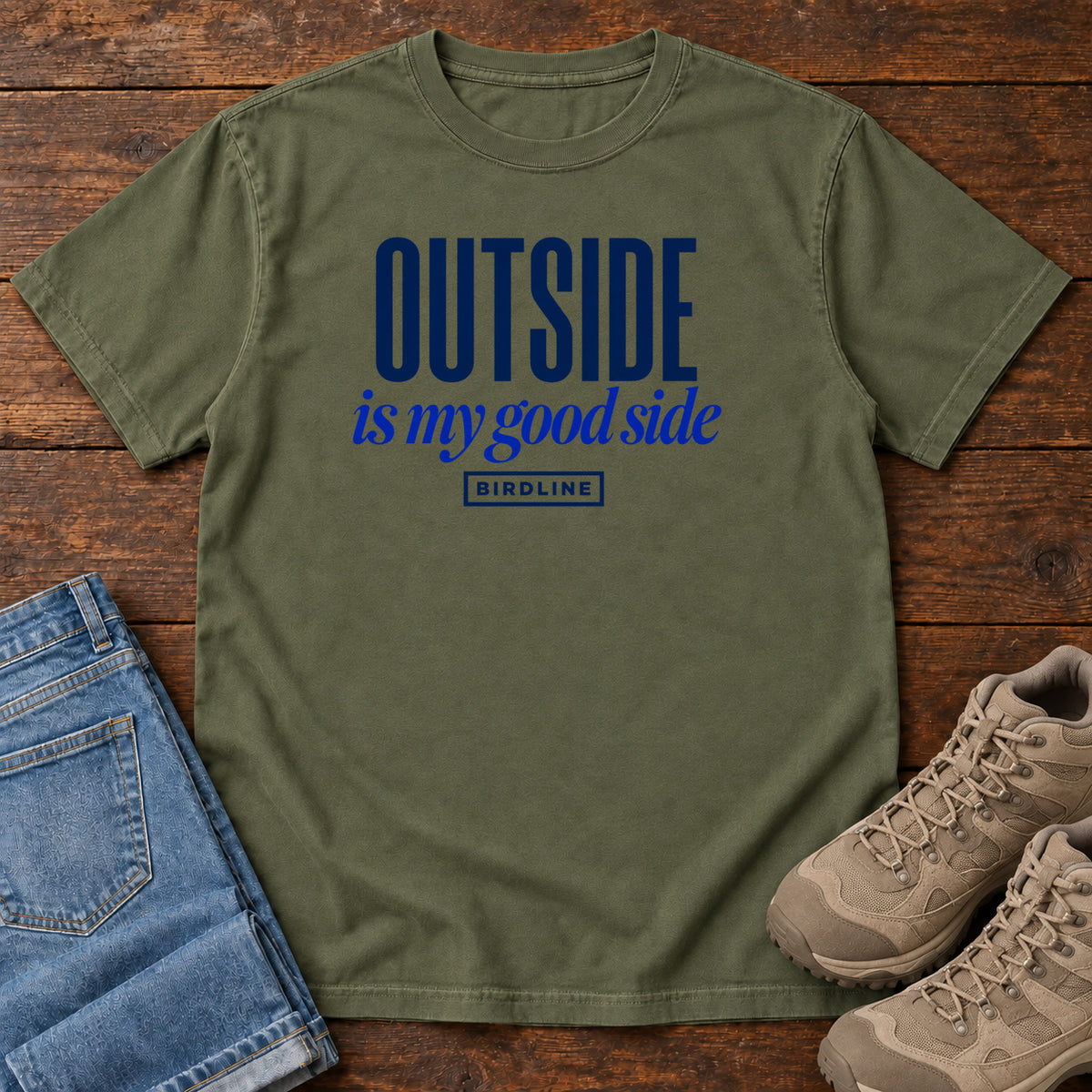 Hemp Outside Is My Good Side T-Shirt with dark blue block-and-script lettering, front flat lay on wood.