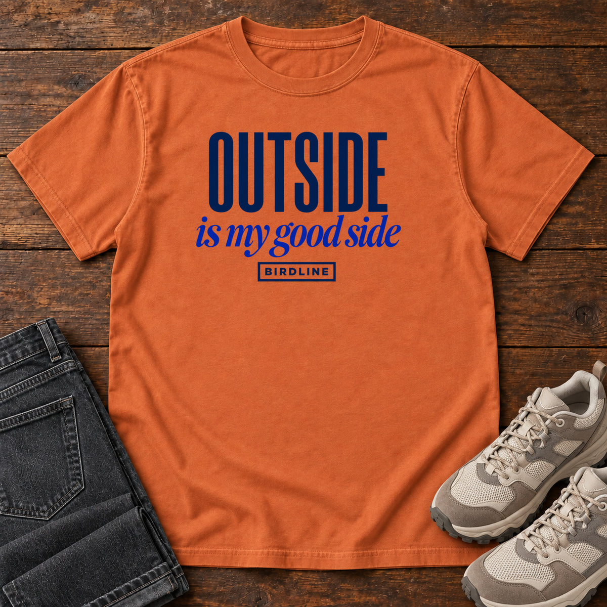 Yam Outside Is My Good Side T-Shirt with dark blue block-and-script lettering, front flat lay on wood.